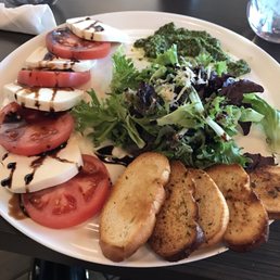 Pane E Vino Pizzeria signature dishes Cheese Pizza, The Italian Sandwich, Meatball Grinder, Tomato and Basil Bruschetta